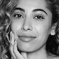 Beautiful mixed-race woman face closeup, black and white photo