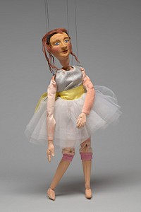 Wooden marionette in ballerina tutu by William N. Buckner