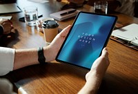 Business man holding digital tablet mockup