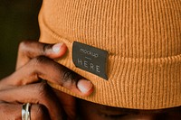 Tan brown woolen hat mockup psd on African American male model