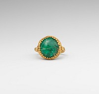 Gold ring set with an emerald