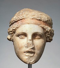 Marble head of a deity wearing a Dionysiac fillet