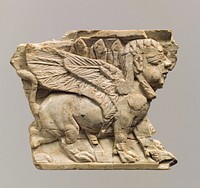 Furniture plaque carved in relief with sphinx