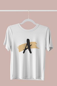 White t-shirt mockup hanging on a clothing rack