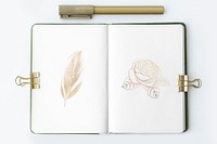 Flower in a notebook page with stationary mockup