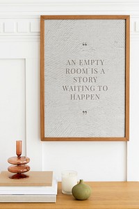 Picture frame mockup psd hanging in a minimal room