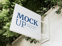 White signboard mockup on a wall