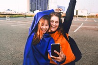 Girls taking selfie, diverse friendship
