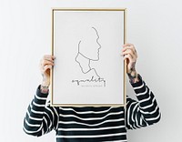 Tattooed woman holding a photo frame mockup