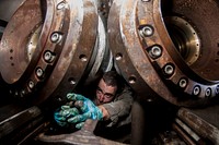 U.S. Navy Aviation Boatswain's Mate (Equipment) Airman Tyler Dufford tightens a bolt on a water break in a catapult water break control room aboard the aircraft carrier USS George Washington (CVN 73) in the East China Sea Oct. 18, 2013.