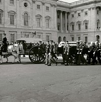 John F. Kennedy Lying in State November 24, 1963President Kennedy funeral procession arrives at the Capitol. Photo by Architect of the Capitol photographers. Original public domain image from Flickr