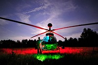 U.S. Army Chief Warrant Officer 3 Bobby Guffy, assigned to the 1st Squadron, 17th Cavalry Regiment, 82nd Airborne Division, stands next to his OH-58D Kiowa Warrior armed reconnaissance helicopter at the range at the Joint Readiness Training Center (JRTC) at Fort Polk, La., Aug. 19, 2013, during JRTC rotation 13-09.