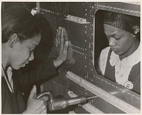 Evelyn T. Gray, Riveter and Pearlyne Smiley, Bucker, Complete a Job on Center Section of a Bomber. Unrestricted. Original public domain image from Flickr