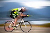 Gary Lawton, a submarine captain with the Australian navy, participates in a bike race during the annual Koa Kai Sprint Triathlon at Marine Corps Air Station Kaneohe Bay, Hawaii, May 4, 2014.