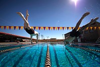 Marine veteran Cpl Kyle Reid, from Chinook, Mont., dives into the pool with fellow athletes during practice at the 2014 Marine Corps Trials on Marine Corps Base Camp Pendleton, Calif., March 10, 2014.