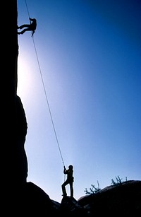 Rock climbers and Belayer