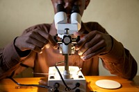 Microscope, African scientist. Credit: Brant Stewart, RTI. Original public domain image from Flickr