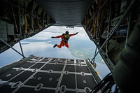 Royal Canadian Air Force Master Cpl. Marc Tremblay, a search and rescue technician with the 417 Combat Support Squadron, jumps out of a U.S. Air Force C-130 Hercules aircraft assigned to the 914th Airlift Wing during Maple Flag 47 over Royal Canadian Air Force 4 Wing at Canadian Forces Base Cold Lake, Alberta province, Canada, June 3, 2014.