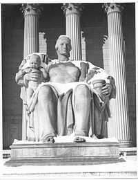 Photograph of the Female Statue, Heritage of the Past, in the Snow near the Constitution Avenue Entrance to the National Archives Building. Original public domain image from Flickr