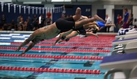 U.S. Marine Corps Sgt. Alex Nguyen takes off for the 50-meter freestyle swim event during the 2014 Warrior Games at the U.S. Olympic Training Center in Colorado Springs, Colo., Sept. 30, 2014.