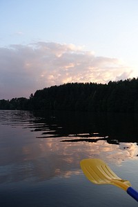 Lake reflection, boat rowing. Original public domain image from Flickr