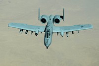 A U.S. Air Force A-10 Warthog departs after refueling with a USAF KC-10 Extender over Southwest Asia in support of Operation Inherent Resolve, Aug. 30, 2015.