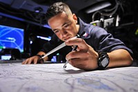 150901-N-WK391-035 PACIFIC OCEAN (Sept. 01, 2015) Operations Specialist 2nd Class Taiese Gaono tracks a course on the chart board aboard the amphibious transport dock ship USS New Orleans (LPD 18) during Exercise Dawn Blitz 2015 (DB-15).