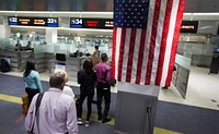 U.S. Customs and Border Protection, Office of Field Operations, officers conduct standard arrival screening operations at Miami International Airport in Miami, Florida, Jan. 10, 2018.