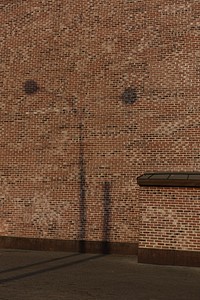 Brick wall, street light shadow. Original public domain image from Flickr
