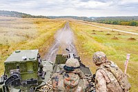 A Slovakian soldier shoots an M2 .50 Caliber machine gun mounted on an Outlaw Troop, 4th Squadron, 2nd Cavalry Regiment Stryker, an eight wheeled armored fighting vehicle, during Slovak Shield 2016 live-fire training Oct. 4, 2016.