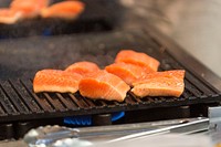 Grilling salmon, seafood. Original public domain image from Flickr