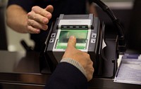 U.S. Customs and Border Protection officers screen international passengers arriving at the Dulles International Airport in Dulles, Va., November 29, 2016.