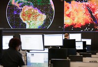 Officers of the U.S. Customs and Border Protection Office of Field Operations conduct global observations of air traffic and trade activities at the new National Targeting Center, December 14, 2016.