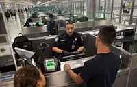 U.S. Customs and Border Protection officers screen international passengers arriving at the Dulles International Airport in Dulles, Va., November 29, 2016.