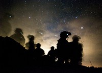 U.S. Marines with 1st Marine Raider Battalion, Marine Raider Regiment, Marine Corps Forces Special Operations Command, await departure during final exercise (FINEX) two as part of Weapons and Tactics Instructors Course (WTI) 2-17, near Yuma, Ariz., April 27, 2017.