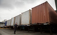 Agriculture inspection specialists with the U.S. Customs and Border Protection, Office of Field Operations, National Agriculture Cargo Targeting Unit, inspect containers of imported goods for invasive insect and plant species that may have hitched a ride to the U.S. from overseas at the Port of Baltimore July 26, 2017.