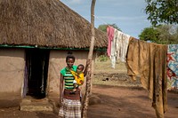 House IRS Kenya 4Jane posing in front of her house.