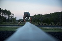 A U.S. Marine Corps recruit of Lima Company, 3rd Recruit Training Battalion, jumps over an obstacle Aug. 17, 2017, on Parris Island, S.C. The obstacle course is used to condition recruits mentally and physically and was designed to improve balance, coordination and physical strength.