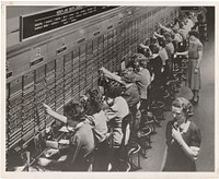 Photograph of Women Working at a Bell System Telephone Switchboard. Original public domain image from Flickr