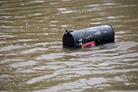 A mail box narrowly breaks the surface above a flooded street in a suburb of Houston, Texas, as U.S Border Patrol riverine agents evacuate residents in the flooded areas in the aftermath of Hurricane Harvey August 30, 2017.