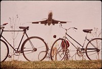 Jet Roars over Bicycle Path near Washington's Nation Airport. Noise-Decibel Level from Aircraft at This Altitude Can Cause Permanent Ear Damage. 11/1972. Original public domain image from Flickr