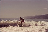 Surfing Along Malibu Beach, California. 10/1972. Original public domain image from Flickr