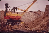 A Huge Shovel Digs Towards A Seam of Coal Off Route 800, Note Its Size in Comparison to the Car by the Tread of the Machine, 10/1973. Original public domain image from Flickr