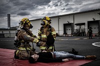 Firefighters at Marine Corps Air Station (MCAS) Iwakuni respond to a simulated casualty during a chemical exposure drill as part of exercise Active Shield at Marine Corps Air Station Iwakuni, Japan, Oct. 17, 2017.