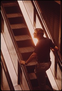 Taking the Escalator from Fountain Square to the Overhead Walkway 06/1973. Photographer: Hubbard, Tom. Original public domain image from Flickr