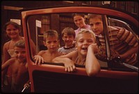 Youngsters in "Over the Rhine" Residential Neighborhood North of the Business District. They Want the Photographer to Take "Just One More" Picture 09/1973. Photographer: Hubbard, Tom. Original public domain image from Flickr