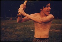 Boy at Bat in a Softball Game in Hiland Park of Brooklyn, New York City. The Inner City Today Is an Absolute Contradiction to the Main Stream America of Gas Stations, Expressways, Shopping Centers and Tract Homes.