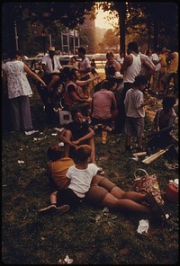 People Relaxing in East River Park in Manhattan, New York City. The Inner City Today Is an Absolute Contradiction to the Main Stream America of Gas Stations, Expressways, Shopping Centers and Tract Homes.
