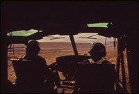 Helicopter Lands near Log Boom in Monument Valley, Utah Site of Clean - Up Operations Following a Massive Oil Spill Into the San Juan River, 10/1972. Original public domain image from Flickr