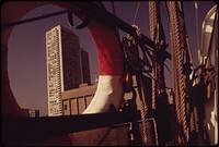 New Apartment Towers Seen through Life Preserver of Sailing Vessel, "Westward", on Long Wharf in Boston Harbor. Original public domain image from Flickr